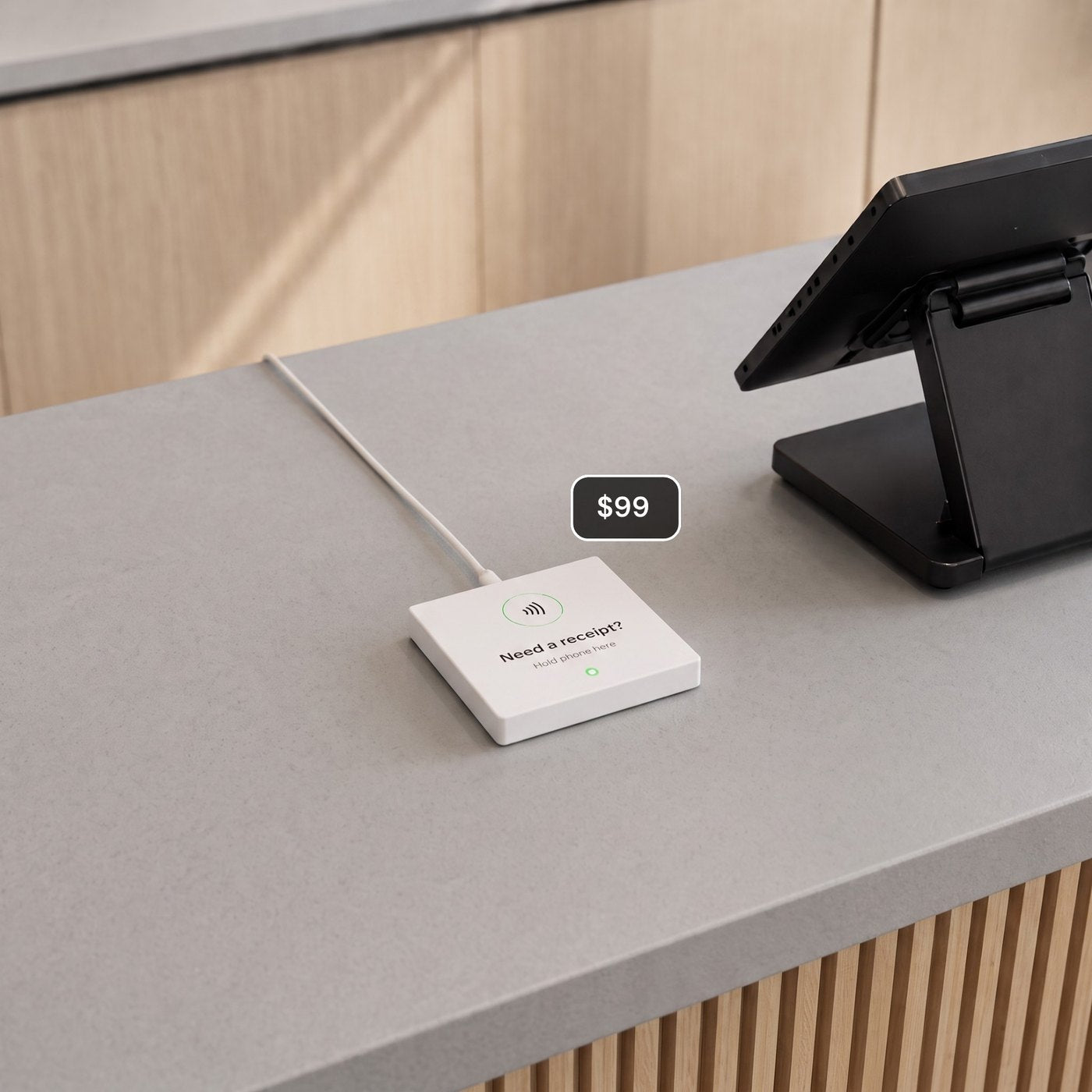 A clean counter with just the Receiptile tile beside the register